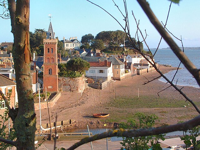 Lympstone river frontage from Cliff Field: Peter's Tower and the traditional washing poles on the beach are visible