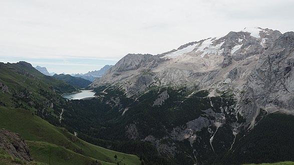 A view from Padon mountain chain to Fedaia lake, rocks in Fassa valley and Col de Bousc.