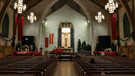 A Moravian star hangs above a Nativity scene in the sanctuary of St. Paul Roman Catholic Church (on left).