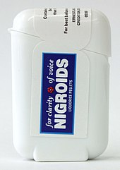 Plastic dispenser containing Nigroids liquorice pellets. Nigroids (plastic dispenser).jpg