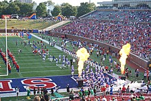 The 2017 SMU football team taking the field before the game against North Texas North Texas vs. Southern Methodist football 2017 03 (Southern Methodist entrance).jpg