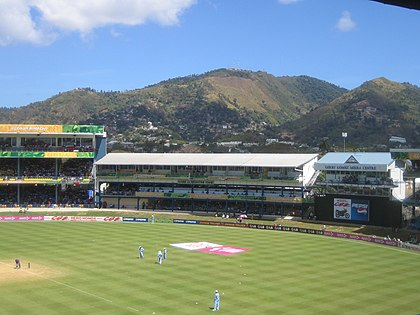 The hills of the Northern Range rising behind the Queen's Park Oval in Trinidad. Northern Range rising behind Queen's Park Oval Trinidad.jpg