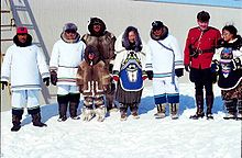 A Mountie standing with an Inuit group in Kinngait to celebrate the establishment of Nunavut, 1999 Nunavut-Feierlichkeit (01-04-99).jpg