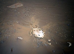 Debris field of Perseverance rover's landing seen from Ingenuity helicopter PIA25219-MarsIngenuityHelicopter-Backshell-20220419.jpg