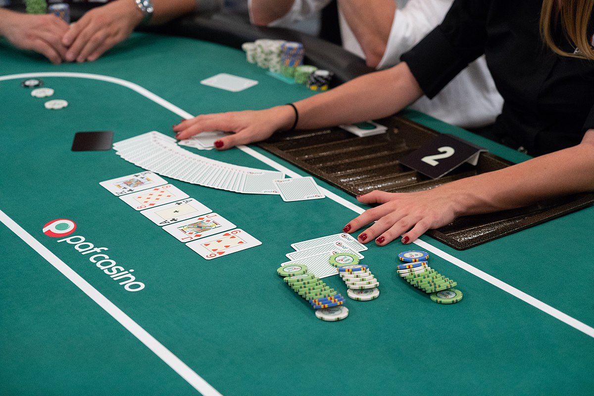 How do you determine the dealer in poker?