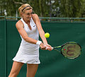 Petra Martić competing in the second round of the 2015 Wimbledon Womens Doubles Qualifying Tournament with Johanna Larsson at the Bank of England Sports Grounds in Roehampton, England. The winners of two rounds of competition qualify for the main draw of Wimbledon the following week.