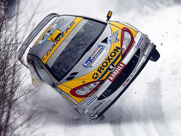 Juuso Pykälistö driving a 206 WRC at the 2003 Swedish Rally.