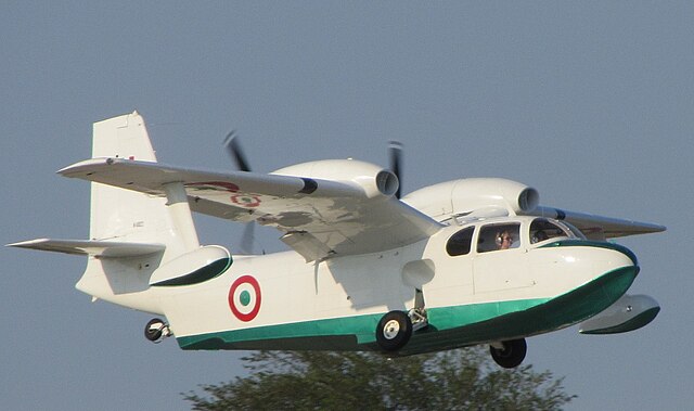 Italian Air Force Piaggio P.136 during takeoff retracting the wheels that make it an amphibian.