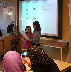 Students present their work to parents