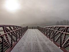 Olaranbe bridge at the Vasco-Navarro railway, frozen in the fog. Álava, Basque Country, Spain