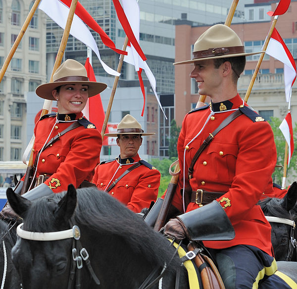 Royal Canadian Mounted Police personnel in ceremonial uniform, which includes a felt campaign hat