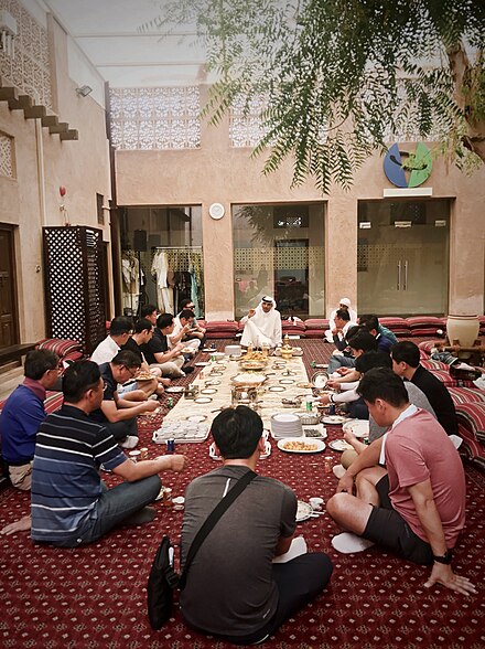 Tourists in Dubai being presented with Emirati food and taught about the eating etiquette.