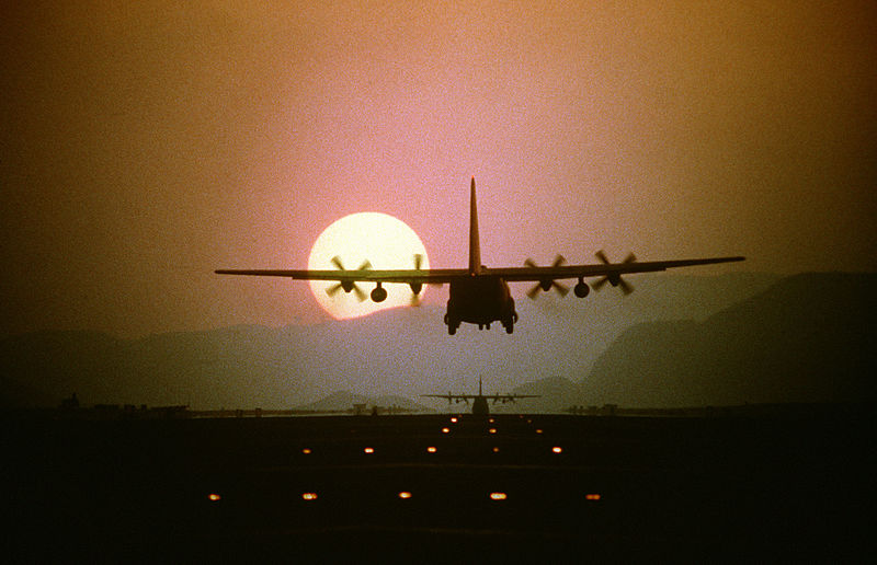 File:Silhouetted by the setting sun, a C-130 Hercules aircraft prepares to land during a 10-ship air drop exercise being conducted by the 21st Tactical Airlift Squadron, 374th Tactical Airlift Wing DF-ST-85-01783.jpg