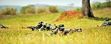 Soldiers with Uganda People’s Defense Force (UPDF) demonstrate skills learned during the UPDF Non-Commissioned Officers Academy (NCOA) in Jinja