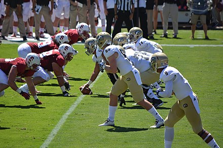 The Aggies football team lines up against Stanford in 2014