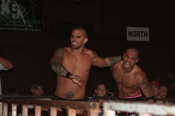 Sterling James Keenan (left) wrestling Shiima Xion (right) for Velocity Pro Wrestling, 2008