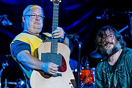 Tenacious D playing guitars onstage