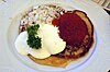 ''Bliny'' buckwheat pancakes with salmon roe (''ikra''), sour cream (''smetana'') and chopped onion