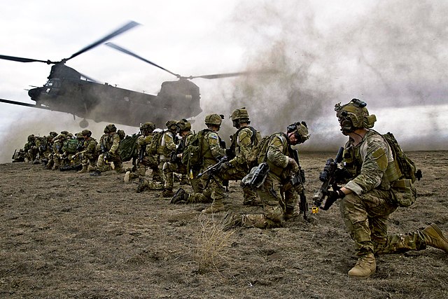 U.S. Army Rangers with the 75th Ranger Regiment prepare for extraction on a MH-47 Chinook