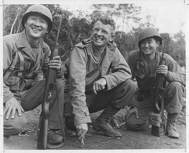 Brig Gen Frank Merrill, commander of "Merrill's Marauders," poses with Herbert Miyasaki and Akiji Yoshimura.