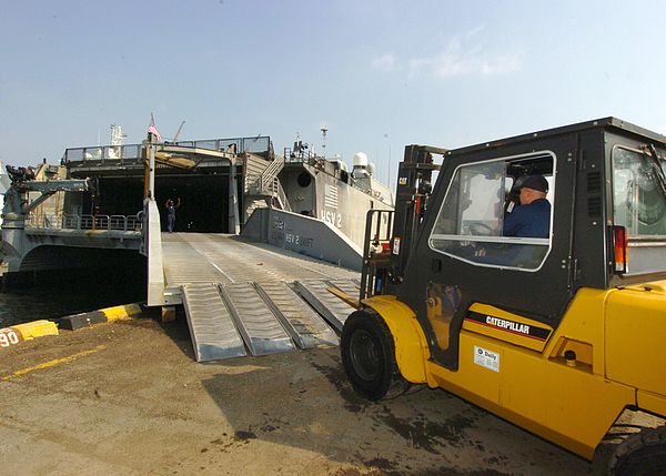 A forklift offloads supplies from Swift in Singapore, 30 January 2005