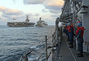 US Navy 120121-N-VY256-012 Sailors aboard the Ticonderoga-class guided-missile cruiser USS Cape St. George (CG 71) watch the Military Sealift Comma.jpg