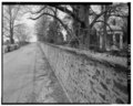 View north along old section of New Bridge Road, western estate wall and Temple of Love to right - A. I. Du Pont Estate, Junction of State Route 141 and Rockland Road, Wilmington HABS DEL,2-WILM.V,9-1.tif