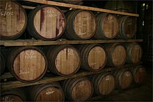 Red wine maturing in oak barrels Wynvate.jpg