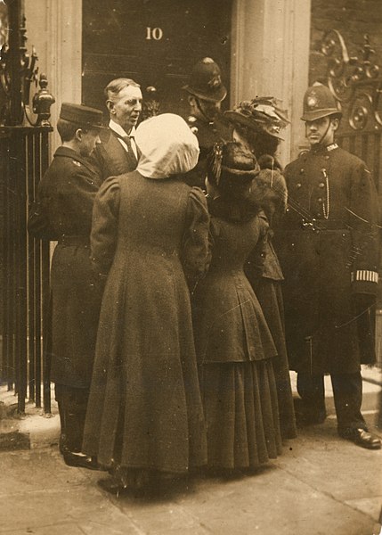 Daisy Solomon and Elspeth Douglas McClelland outside 10 Downing Street in 1909, trying to have themselves delivered as letters