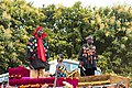 2 chiefs standing in their palanquin