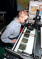 TARPS Intelligence Specialist uses a light table to analyze film from KS-87 camera.