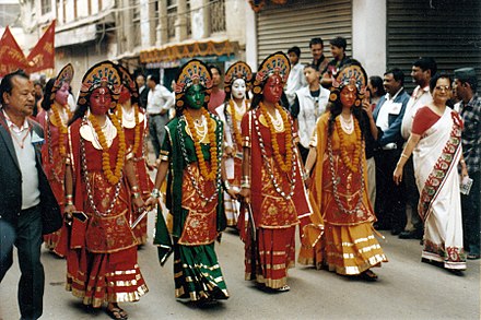 Actors dressed up as Ajima mother goddesses take part in New Year's Day parade in Kathmandu.