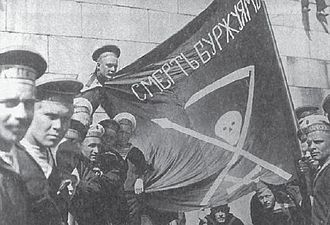 Revolutionary Russian seamen with their skull insignia. The flag says Death to the bourgeoisie! in Russian. Anarkistimatruuseja.jpg