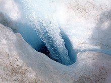 Surface water entering a moulin on Athabasca Glacier Athabasca.Moulin.jpg