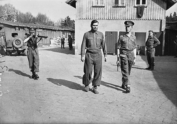 SS-Hauptsturmführer Josef Kramer, photographed in legcuffs at Belsen before being removed to the POW cage at Celle, 17 April 1945.