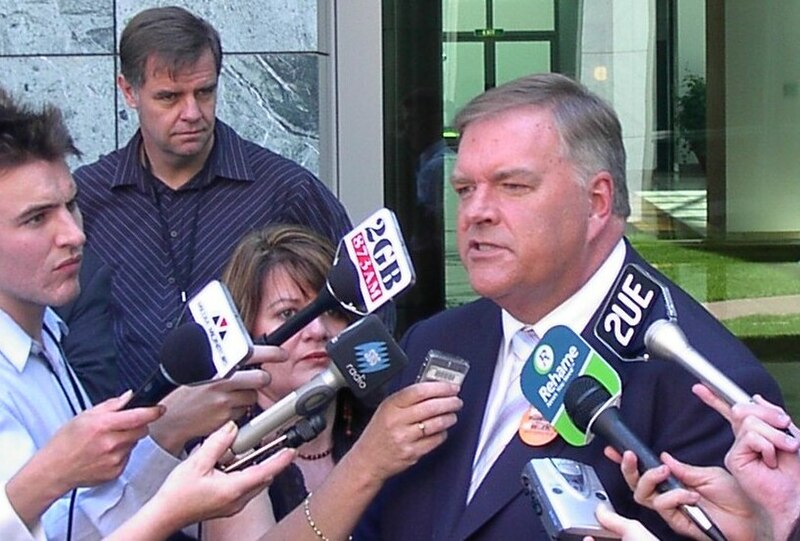 File:Beazley press conference 2005, journalists Andrew Greene and Matt Price in background (cropped).JPG