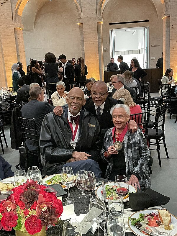 Bettye Saar with fellow UCLA Bruin Kareem Abdul-Jabbar receiving The W.E.B. Du Bois Medal from Henry Louis Gates at Harvard on October 6, 2022.