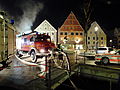 Löschversuche der Feuerwehr nach über 14 Stunden nach Ausbruch des Brandes.