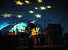 Stevens performing in Waikiki Shell, Oahu, Hawaii, 1974. The stage decor reflects his song, "Boy with a Moon & Star on His Head" from Catch Bull at Four. Cat Stevens 1974 Moon and Stars.jpg