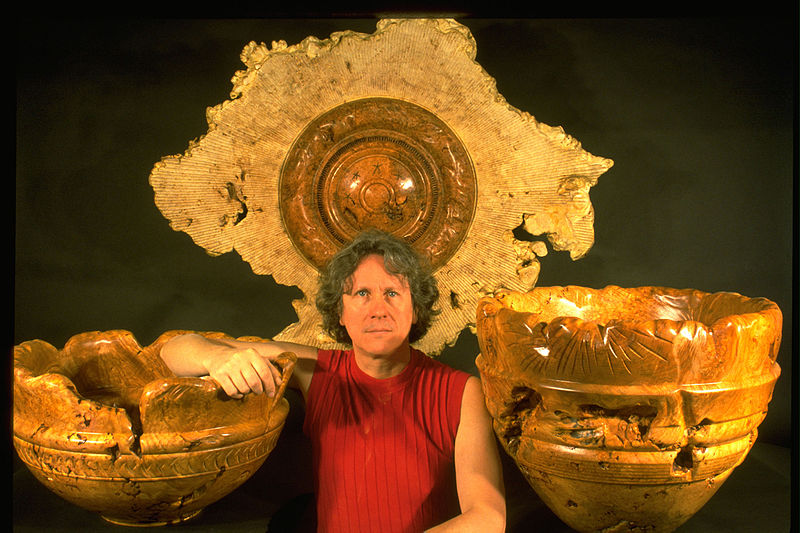 File:Dennis Elliott and his wood sculptures 1997.jpg