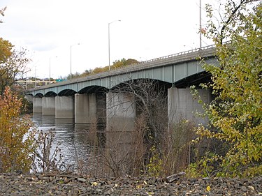 The upstream side of the Dexter Coffin Bridge pictured from Windsor Locks, Connecticut