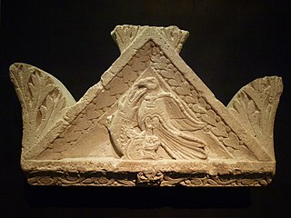 gable crowning a tomb niche: an eagle poised above a fish