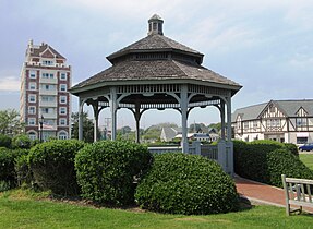 The gazebo on The Plaza. Note the Tudor Revival architecture on the buildings behind it to the right, and the Tower at Montauk to the left.