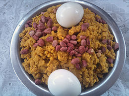 Etor is a popular dish in south Ghana, prepared with plantain or with yam boiled and mashed, and mixed with palm oil. Groundnuts (peanuts) and eggs are used to garnish the dish. Ghanaian Delicacy- Etor.jpg