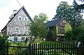 Residential stable house and barn of a two-sided courtyard