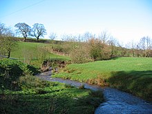 The Iscoyd Brook, near Whitewell. It flows into the Wych Brook (formerly the River Elfe), which forms the northern parish boundary. Iscoyd Brook - geograph.org.uk - 336595.jpg