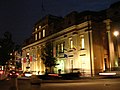 Canada House by night, showing the flags of the provinces and territories of Canada on the side