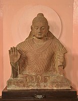 Buddha in Abhaya Mudra. Kushana-Gupta transitional period. Circa 3rd-4th century, Mathura.[44]