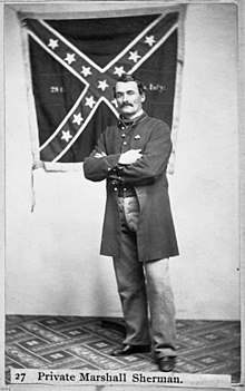 Marshall Sherman poses with the 28th Virginia battle flag in 1864
