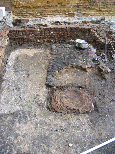 Late medieval tile hearth and associated floor